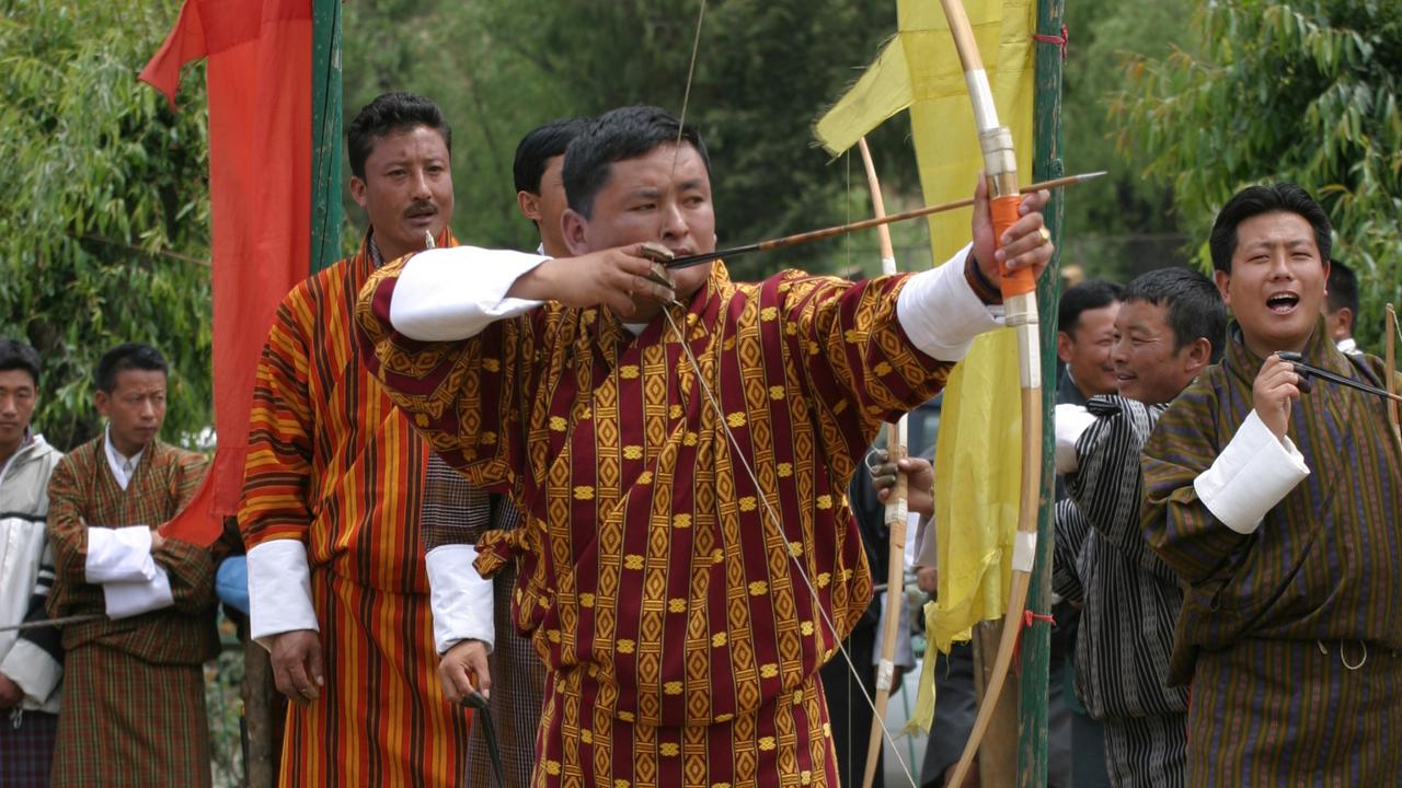Men doing archery in Bhutan