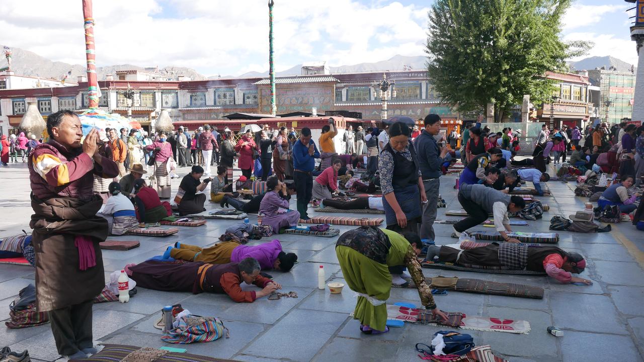 Praying at the Jongkham Palace in Lhasa, Tibet