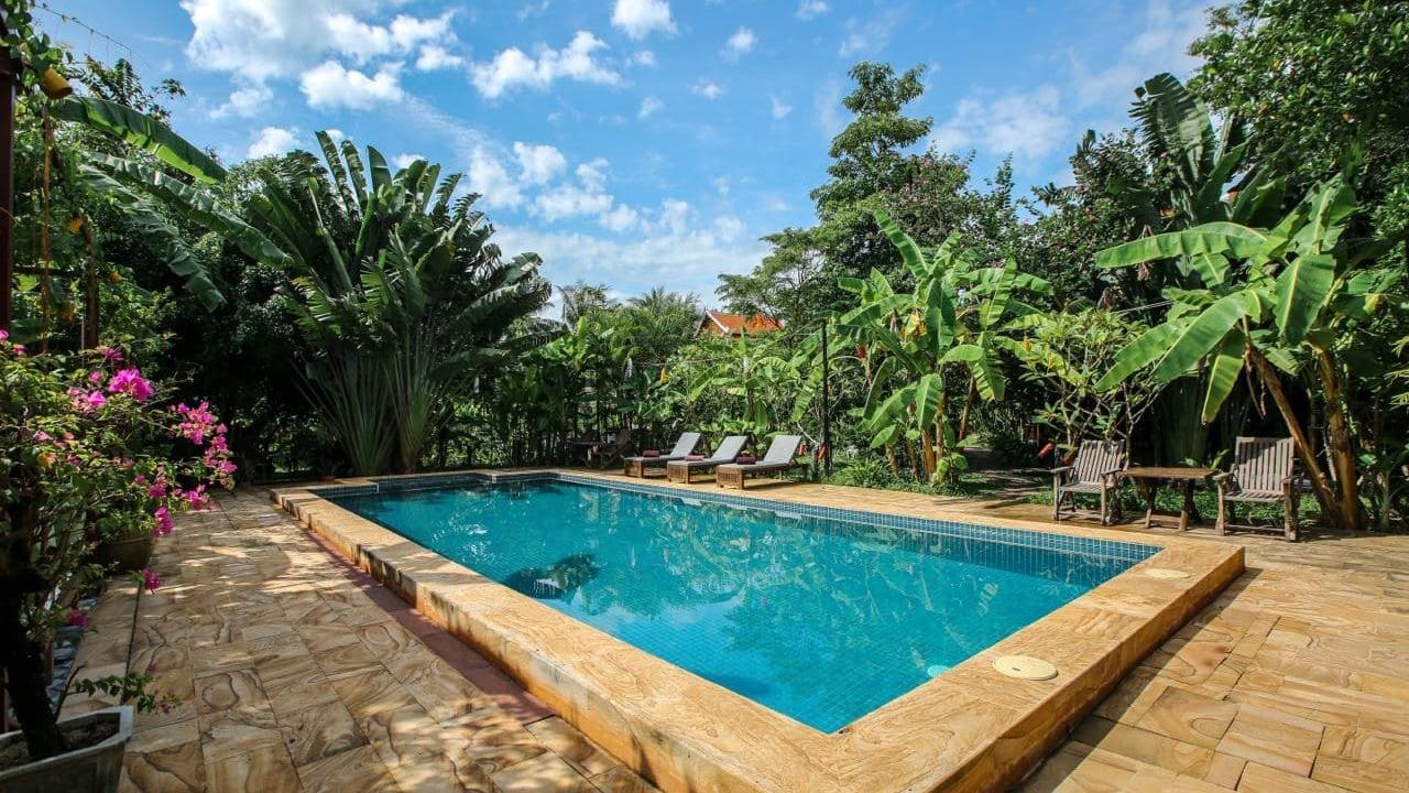 Outdoor pool at Maisons Wat Kor