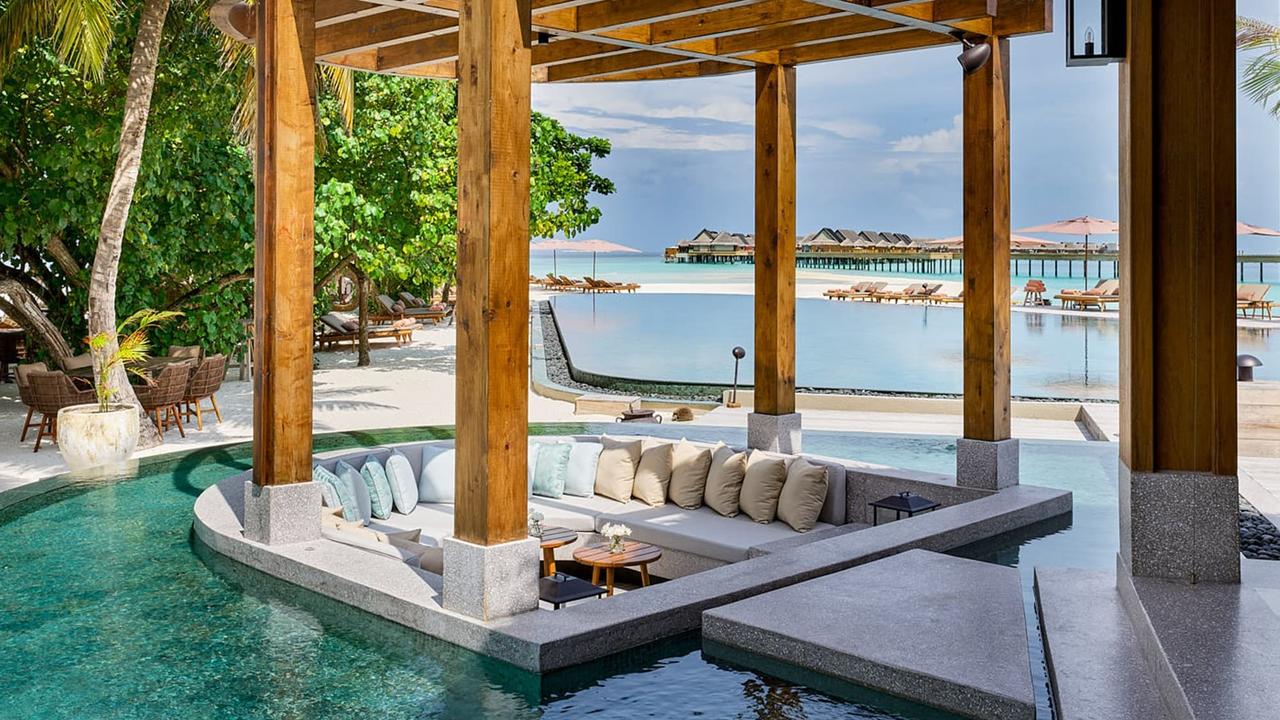 Seating by pool at Joali Maldives