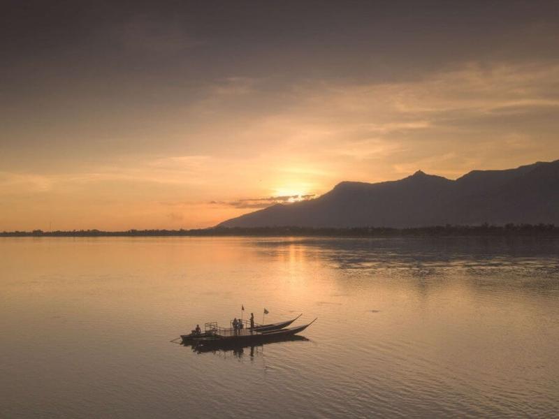 Boat on the Mekong River at sunset