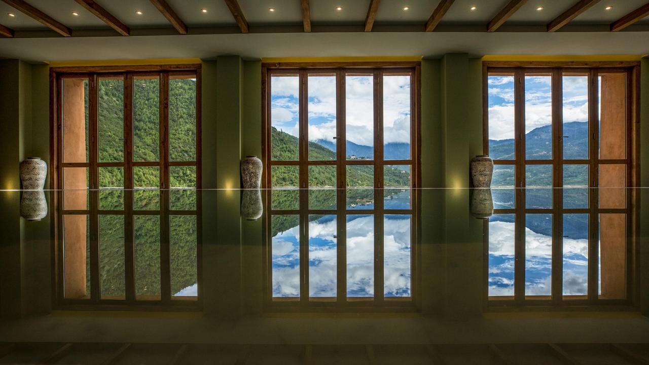 Swimming pool overlooking mountains at Bhutan Spirit Sanctuary