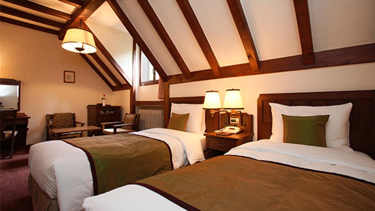Cosy twin room with beams at Kamikochi Imperial Hotel