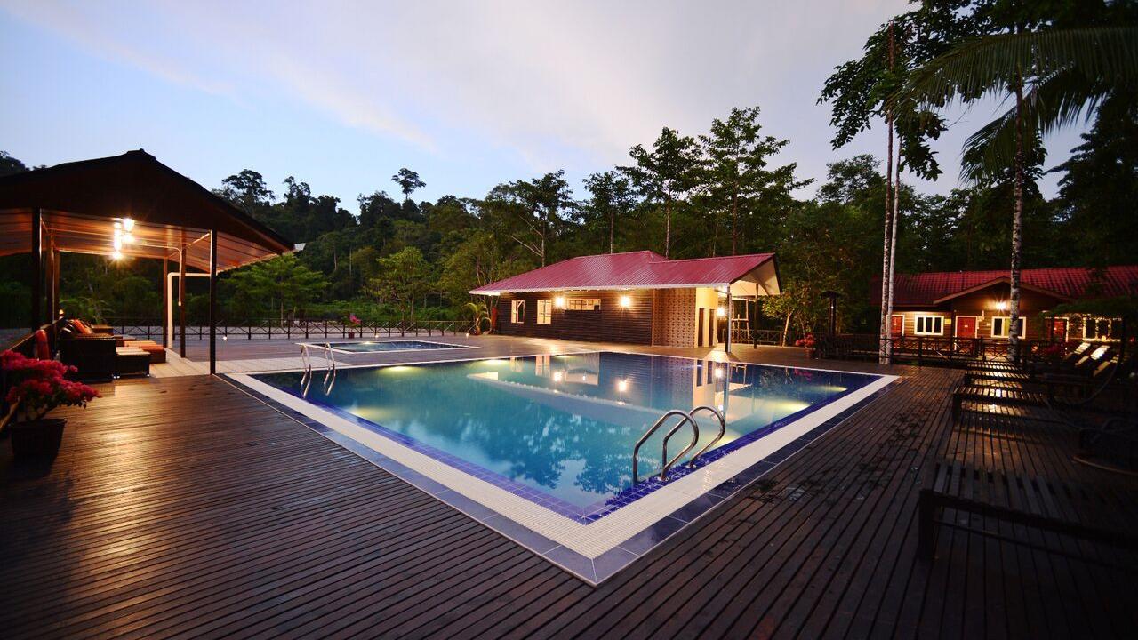 Swimming pool at dusk at Kinabatangan Riverside Lodge