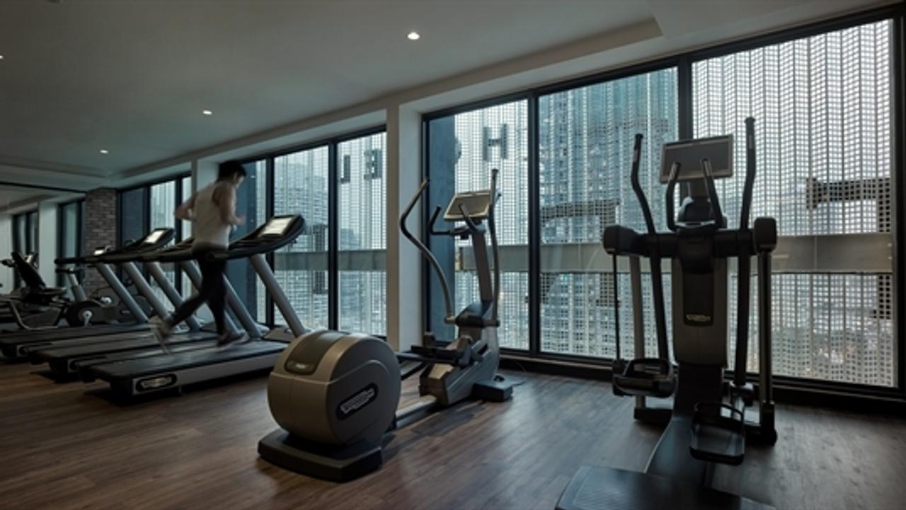 Gym with a city view at Hotel Stripes