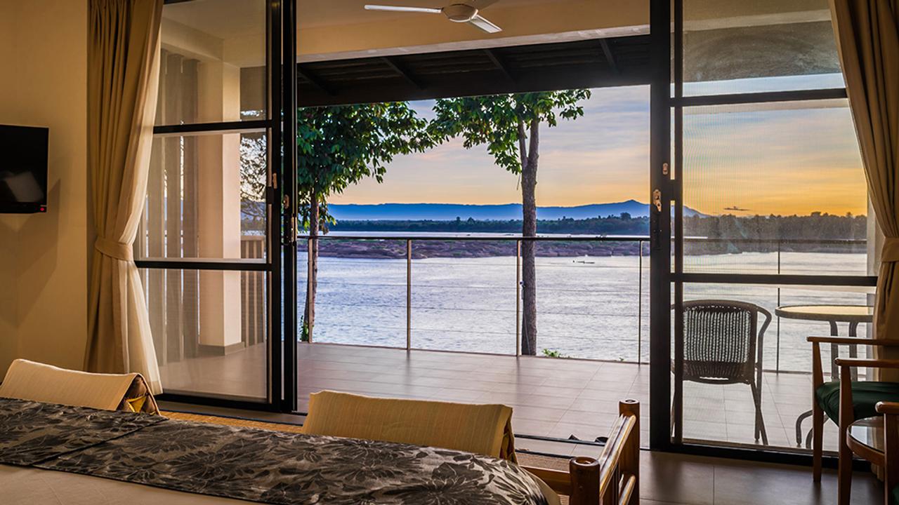 Bedroom with river views at River Resort
