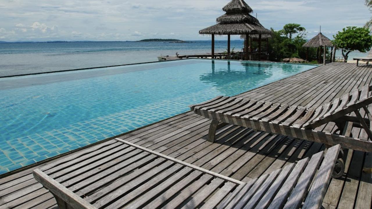 Sun loungers by the pool at Koh Munnork Island Resort