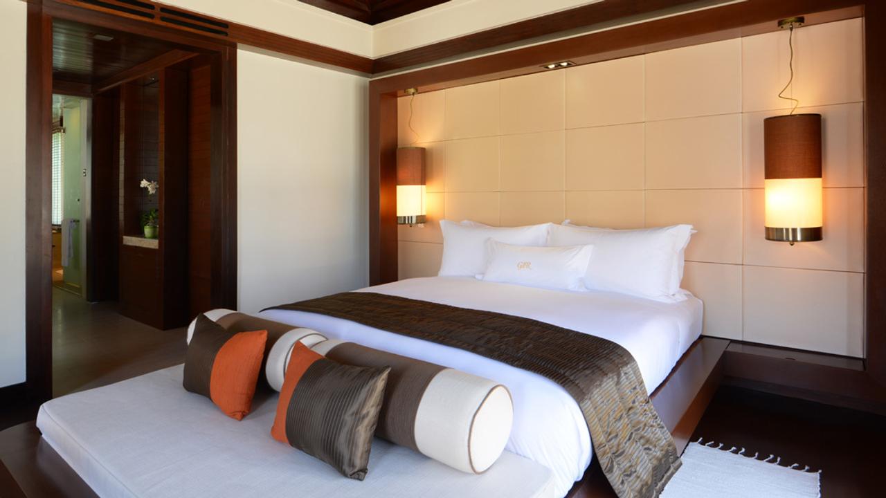 Villa with double bed at Gaya Island Resort