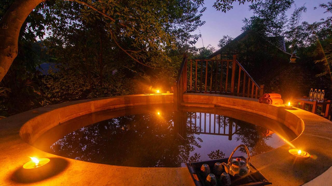 Hot tub at night at Muang La Resort