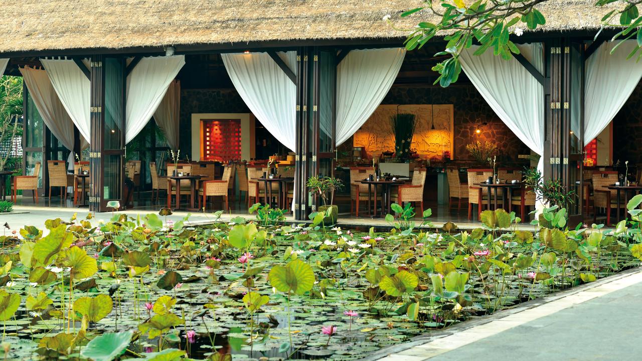 Restaurant overlooking pond at Belmond Jimbaran Puri