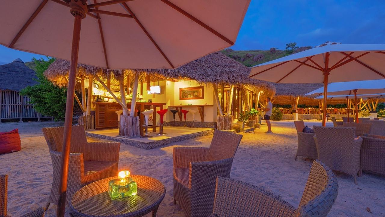Beach bar by night at Komodo Resort