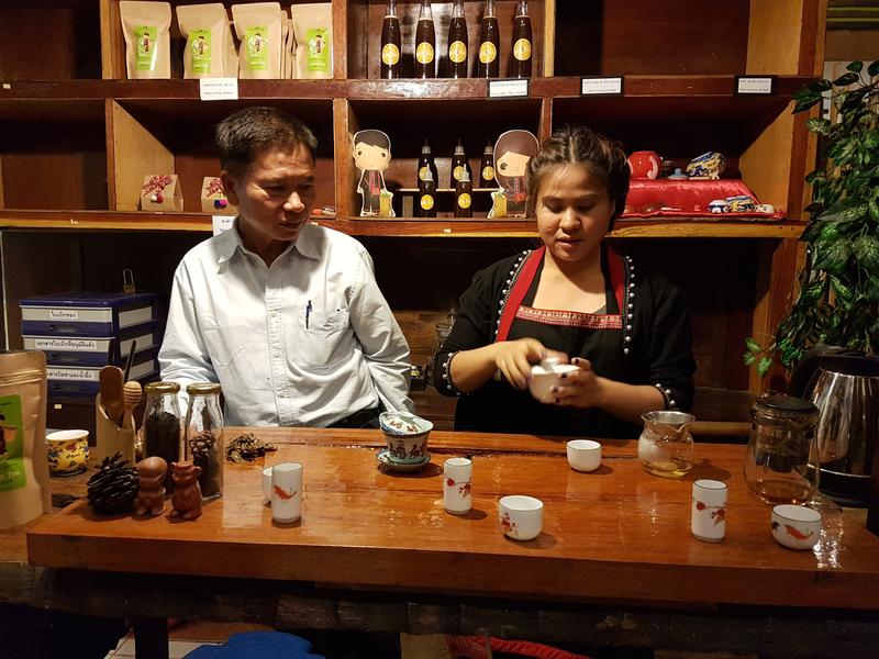 Man and woman preparing tea at Phumanee Lahu Home Hotel